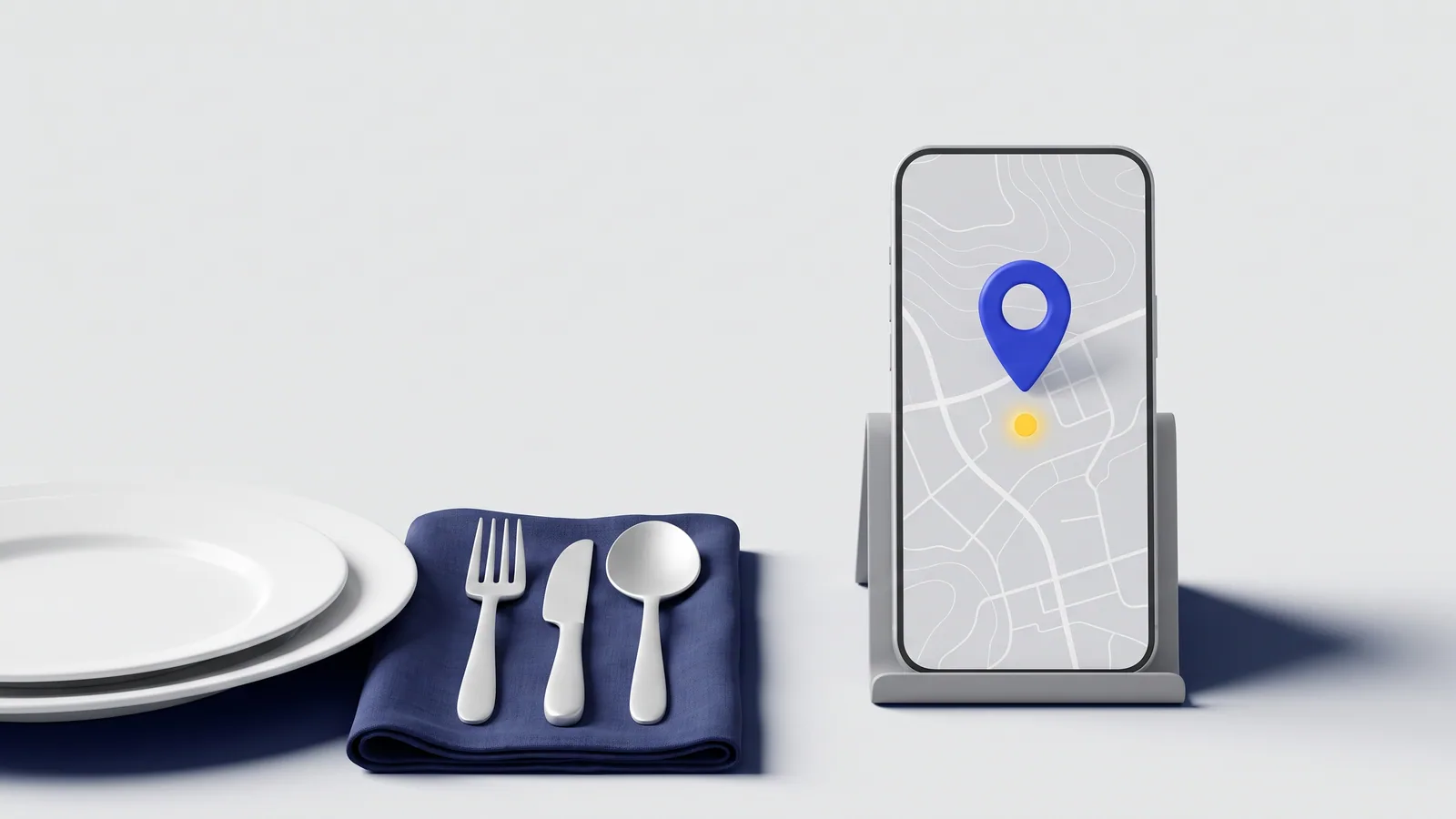 A set table next to a phone showing the map